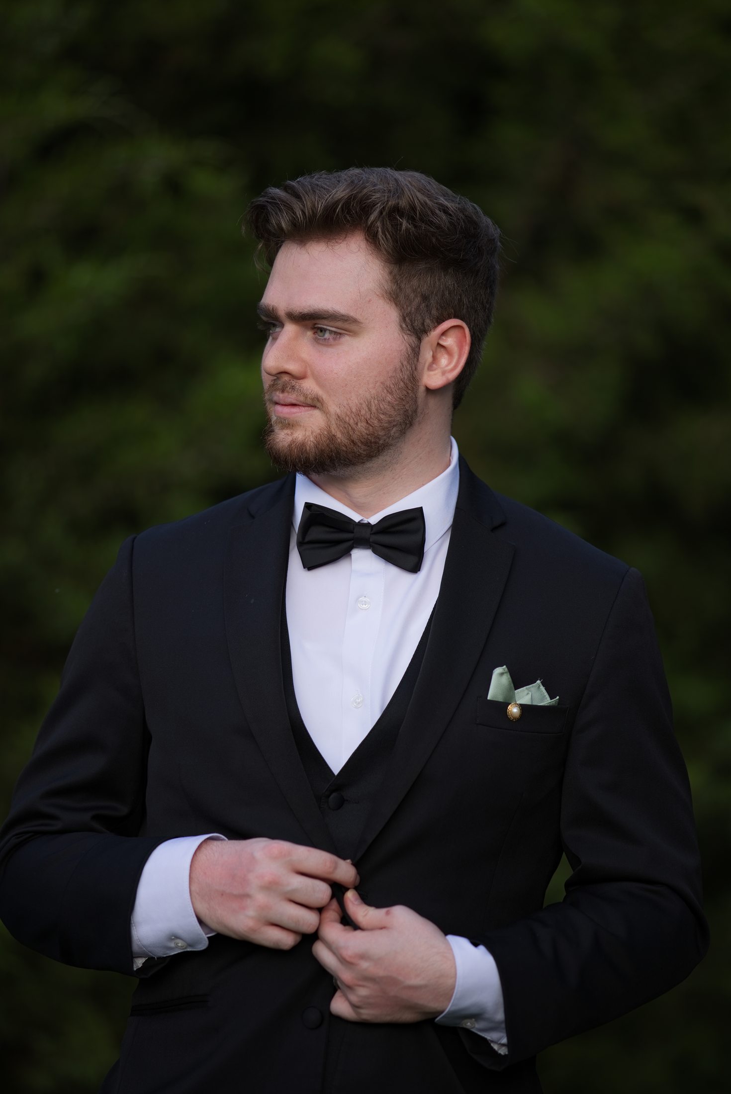 Portrait of Brennan Sarbaugh in a black tuxedo